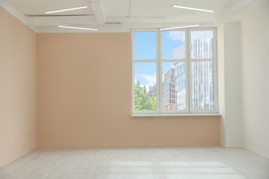 Photo of Light spacious room with window and unfinished laminate flooring