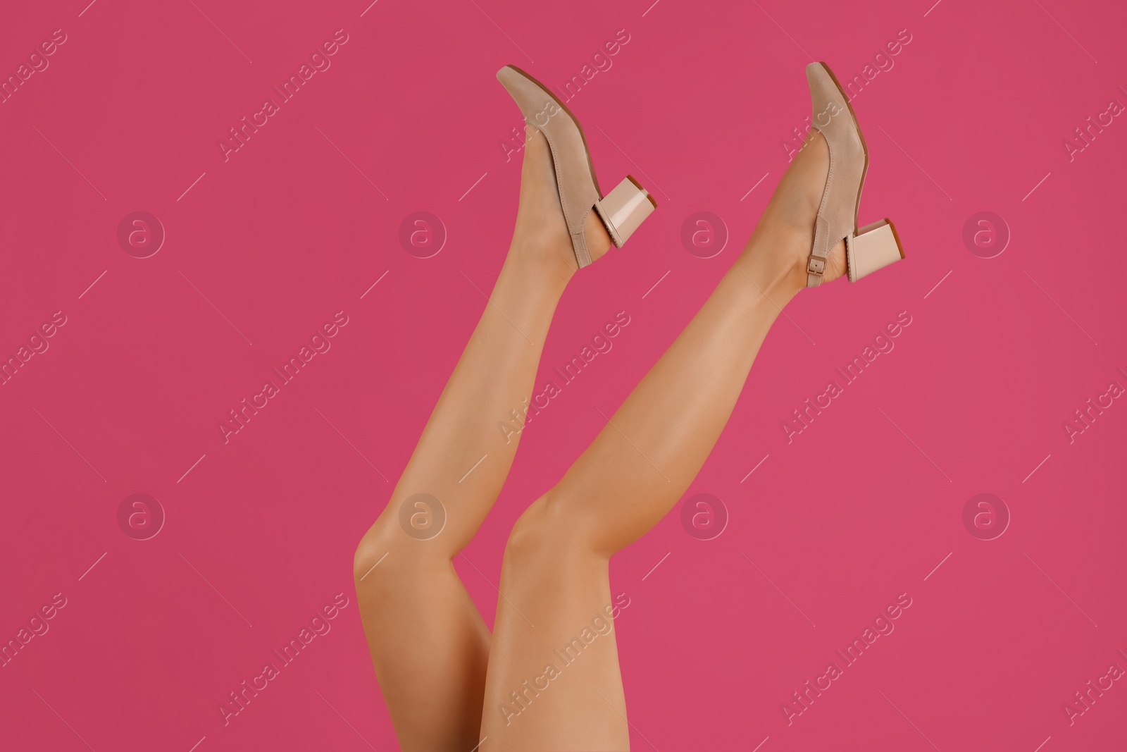 Photo of Woman wearing stylish shoes on pink background, closeup