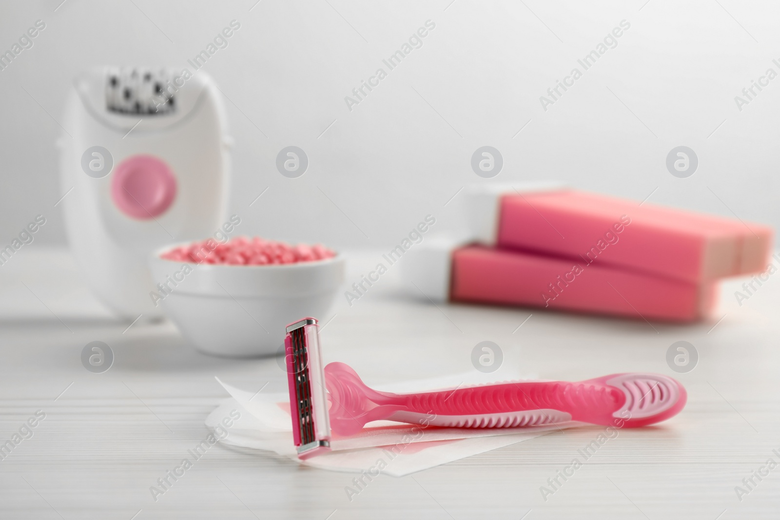 Photo of Set of epilation products on white wooden table