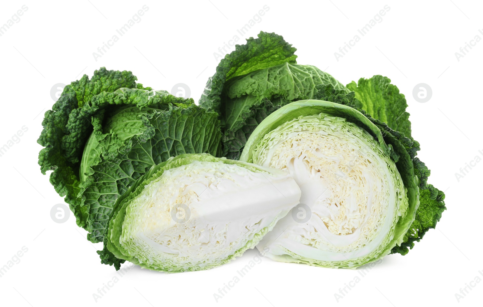 Photo of Whole and cut fresh savoy cabbages on white background
