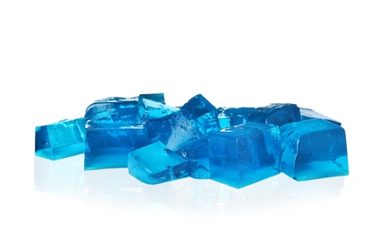 Heap of blue jelly cubes on white background