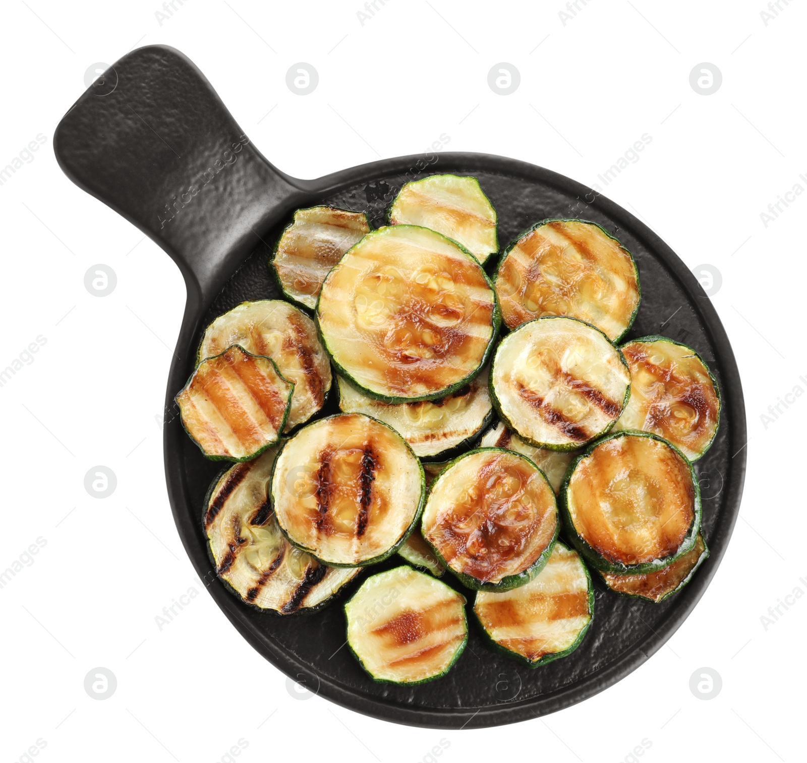 Photo of Slate plate of delicious grilled zucchini slices on white background, top view