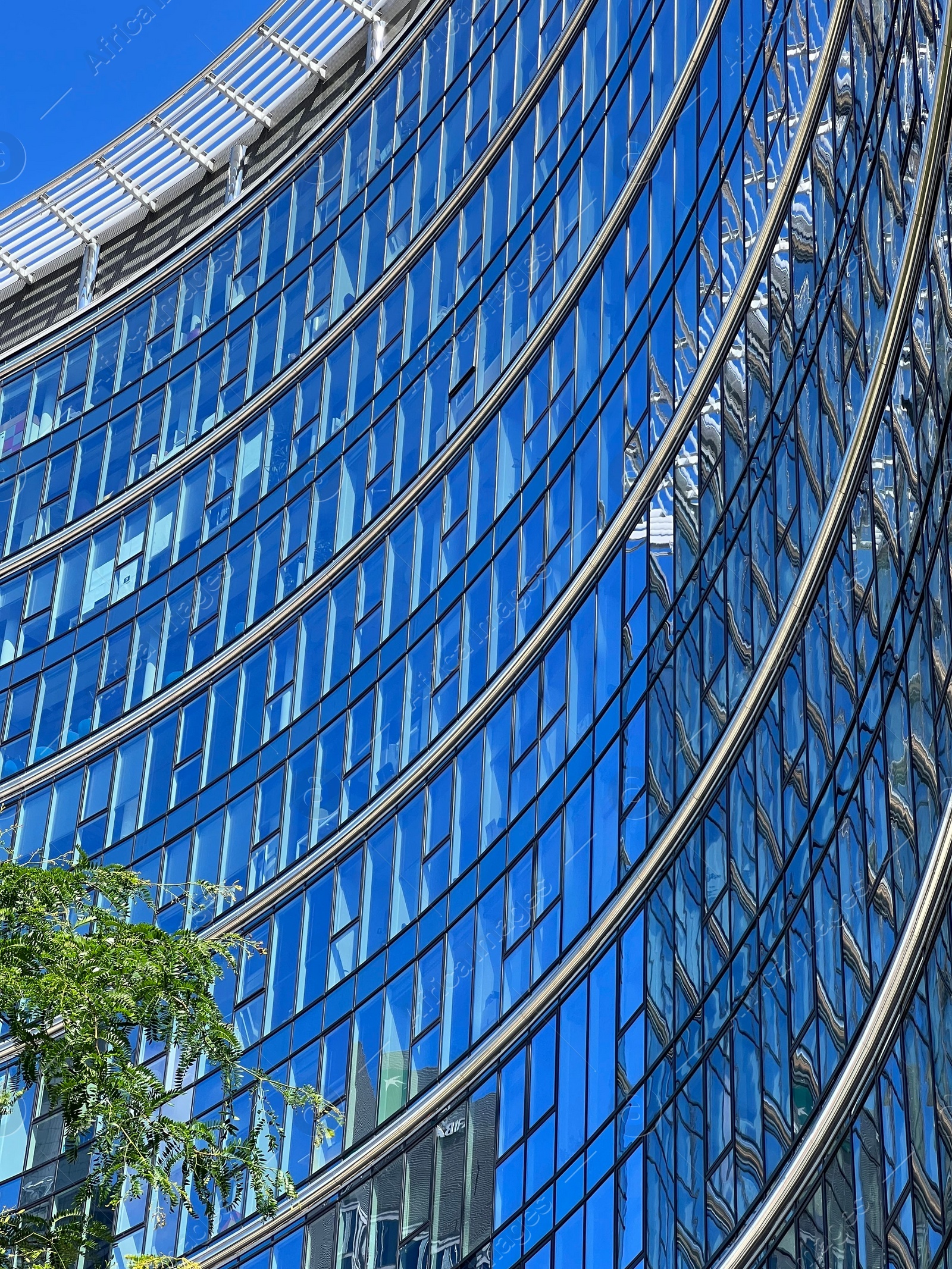 Photo of Low angle view of modern office building on sunny day