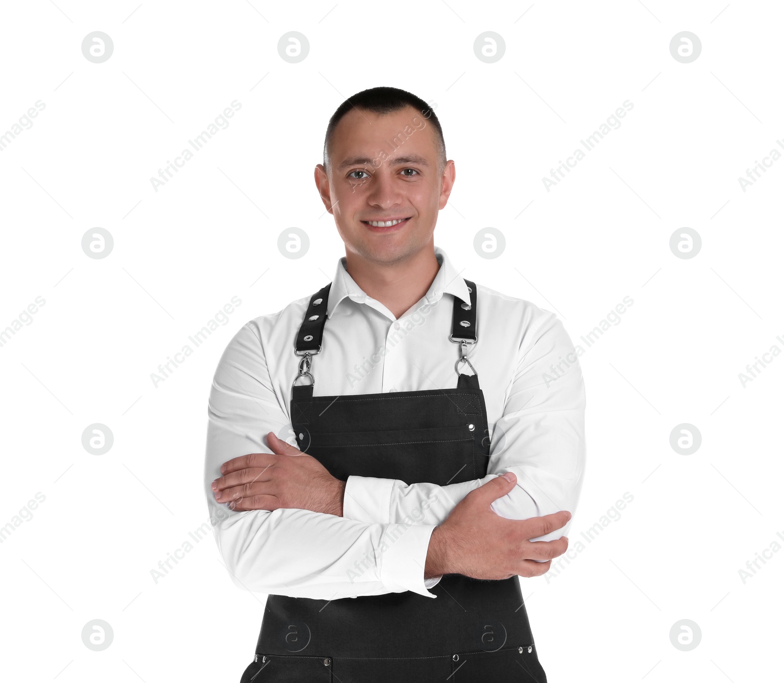 Photo of Portrait of happy young waiter in uniform on white background