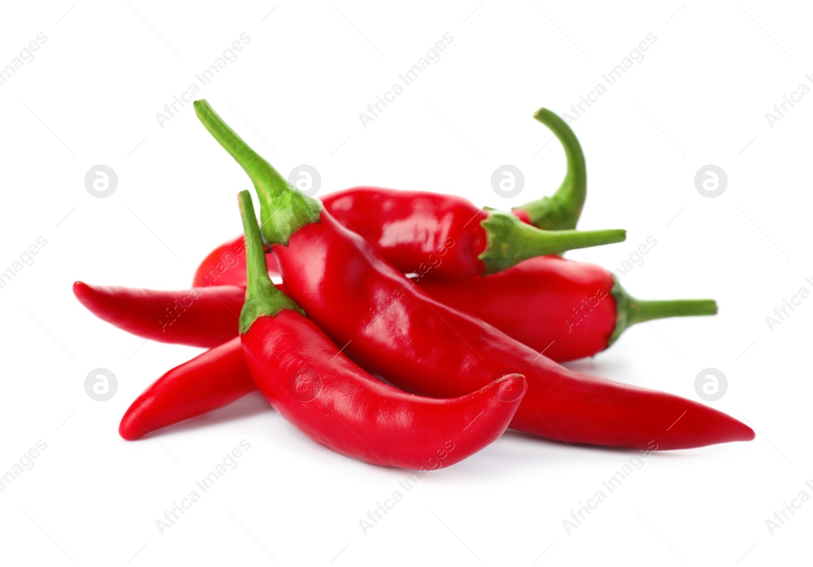 Photo of Heap of red chili peppers on white background