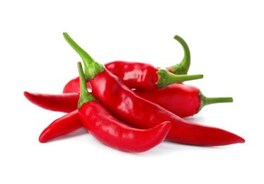 Photo of Heap of red chili peppers on white background