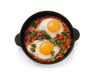 Delicious shakshuka in frying pan isolated on white, top view