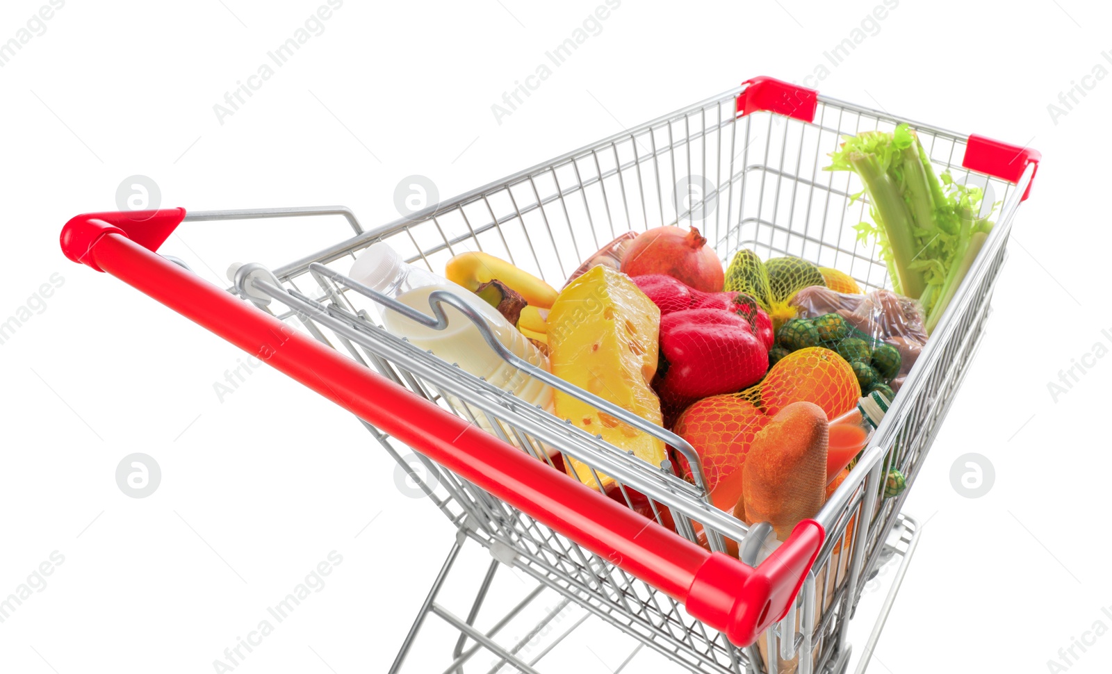 Photo of Shopping cart with fresh groceries on white background