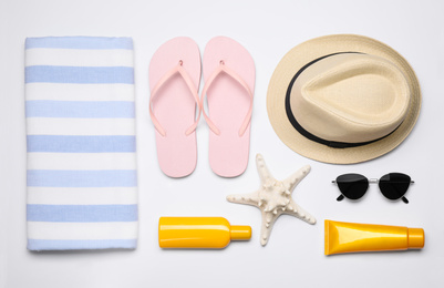 Photo of Flat lay composition with beach objects on white background