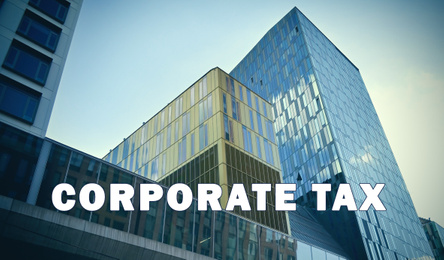 Image of Corporate tax concept. Modern office building with tinted windows outdoors