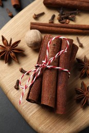 Different spices and nut on table, flat lay