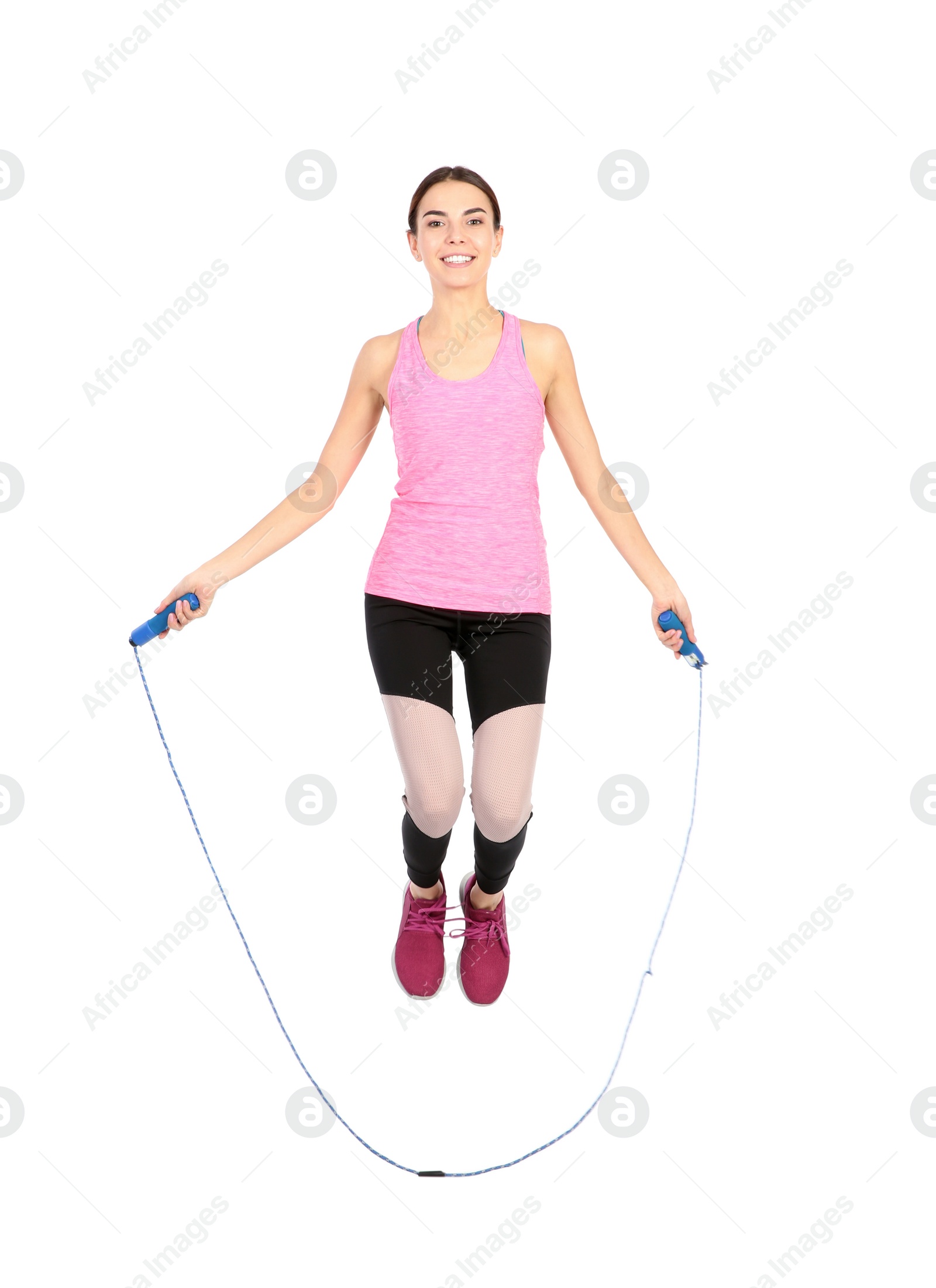 Photo of Full length portrait of young sportive woman training with jump rope on white background