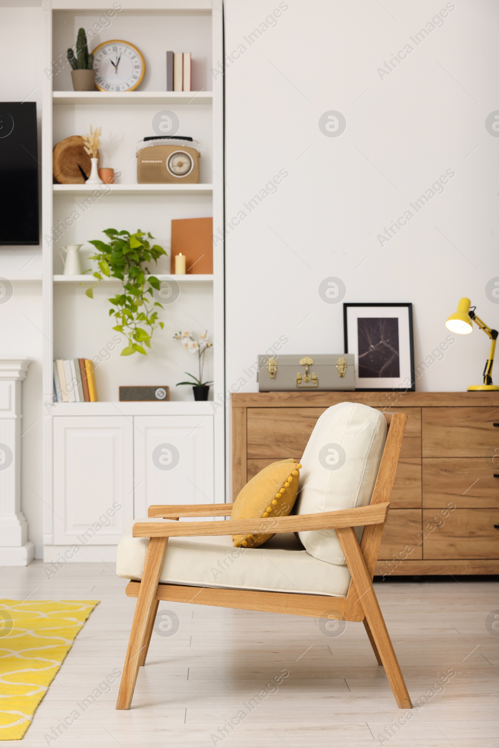 Photo of Spring atmosphere. Cosy furniture and potted plant in stylish room