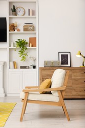 Spring atmosphere. Cosy furniture and potted plant in stylish room