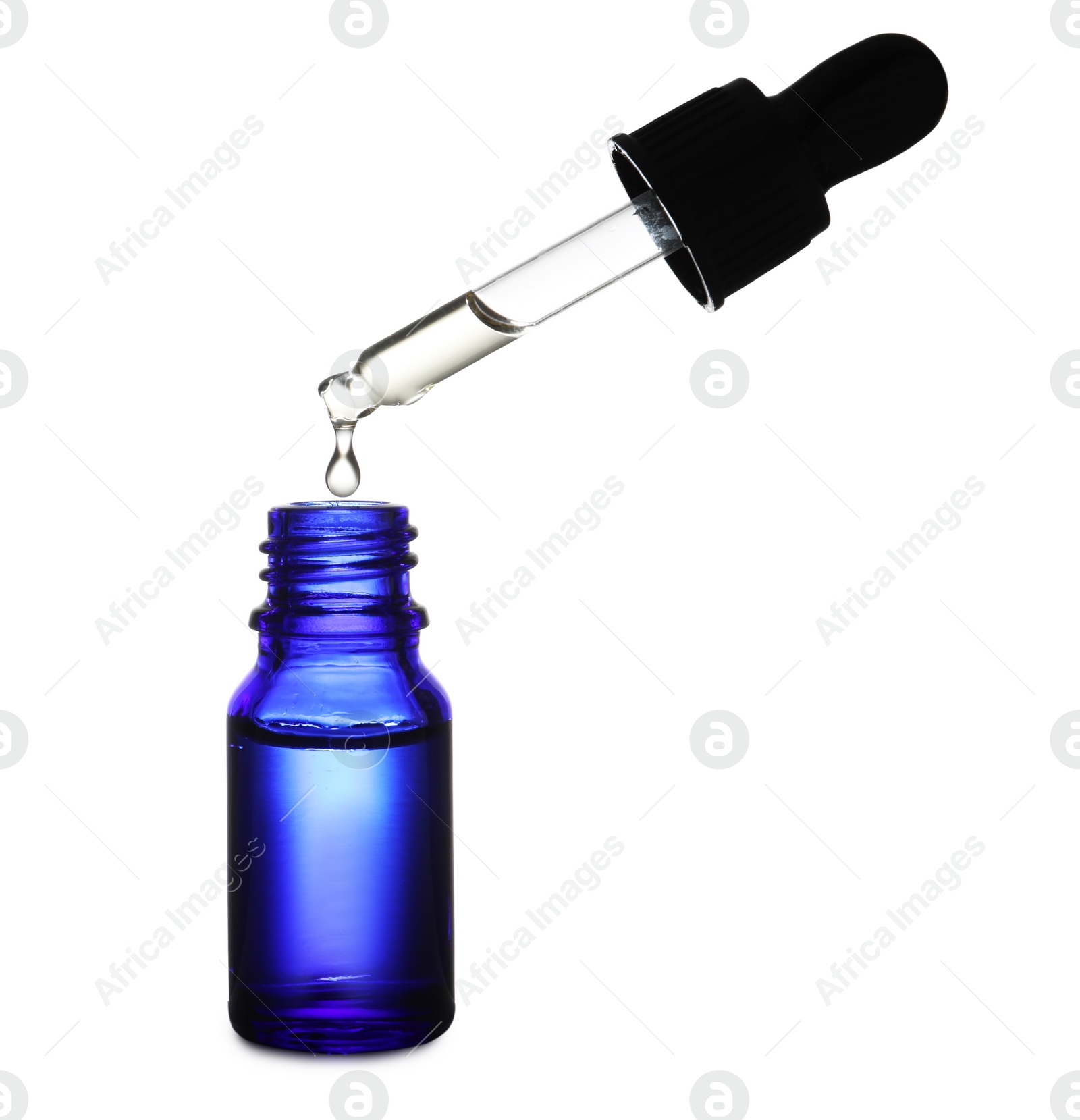 Photo of Bottle and pipette with essential oil on white background