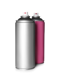 Photo of Colorful cans of spray paints on white background