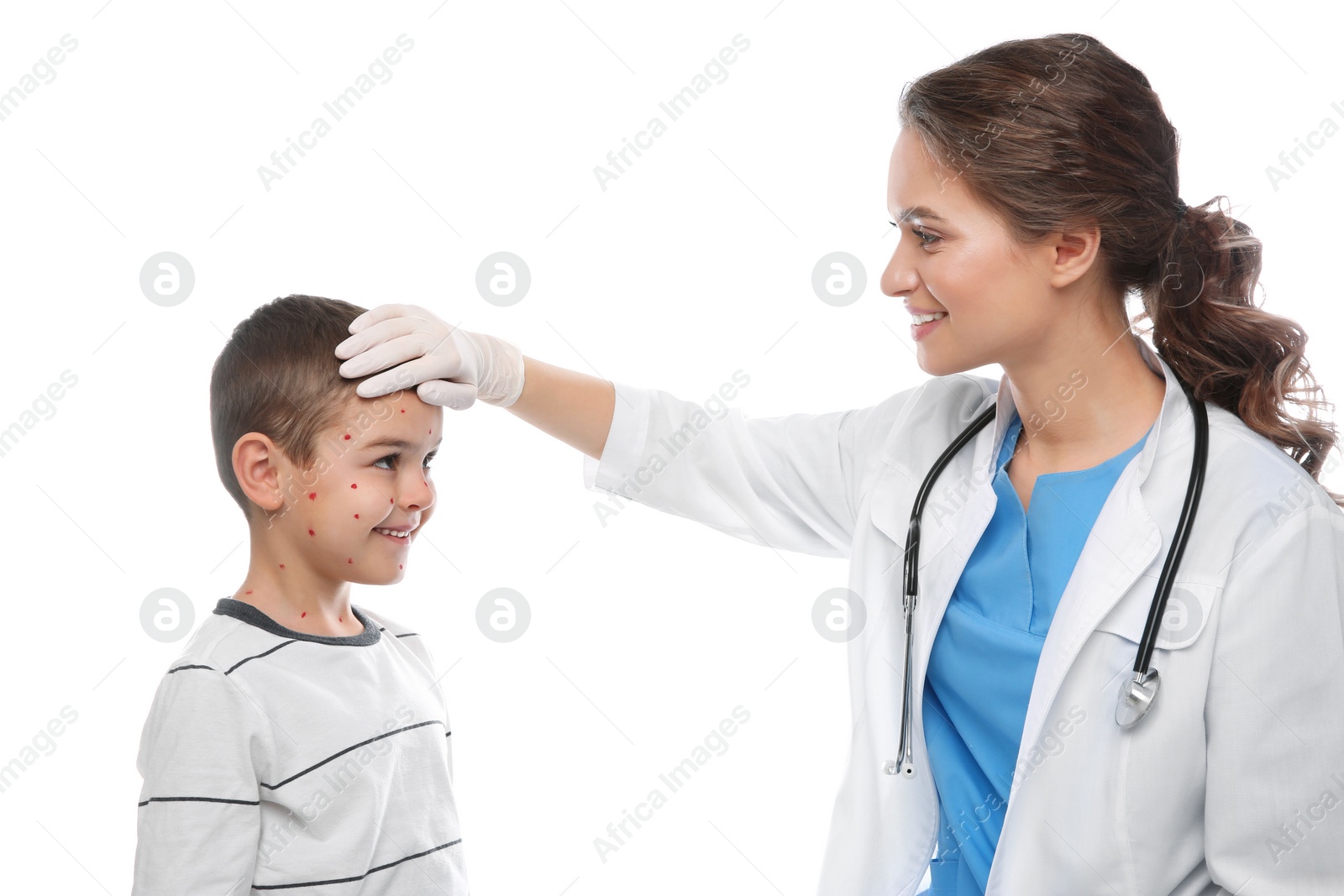 Photo of Doctor examining little boy with chickenpox on white background. Varicella zoster virus