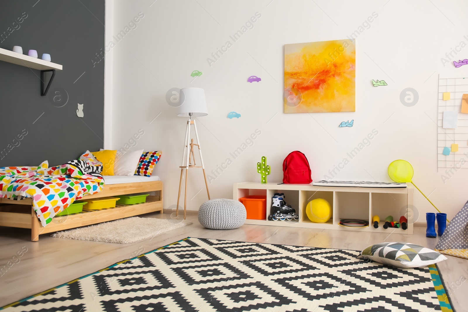 Photo of Modern room interior with comfortable bed for child