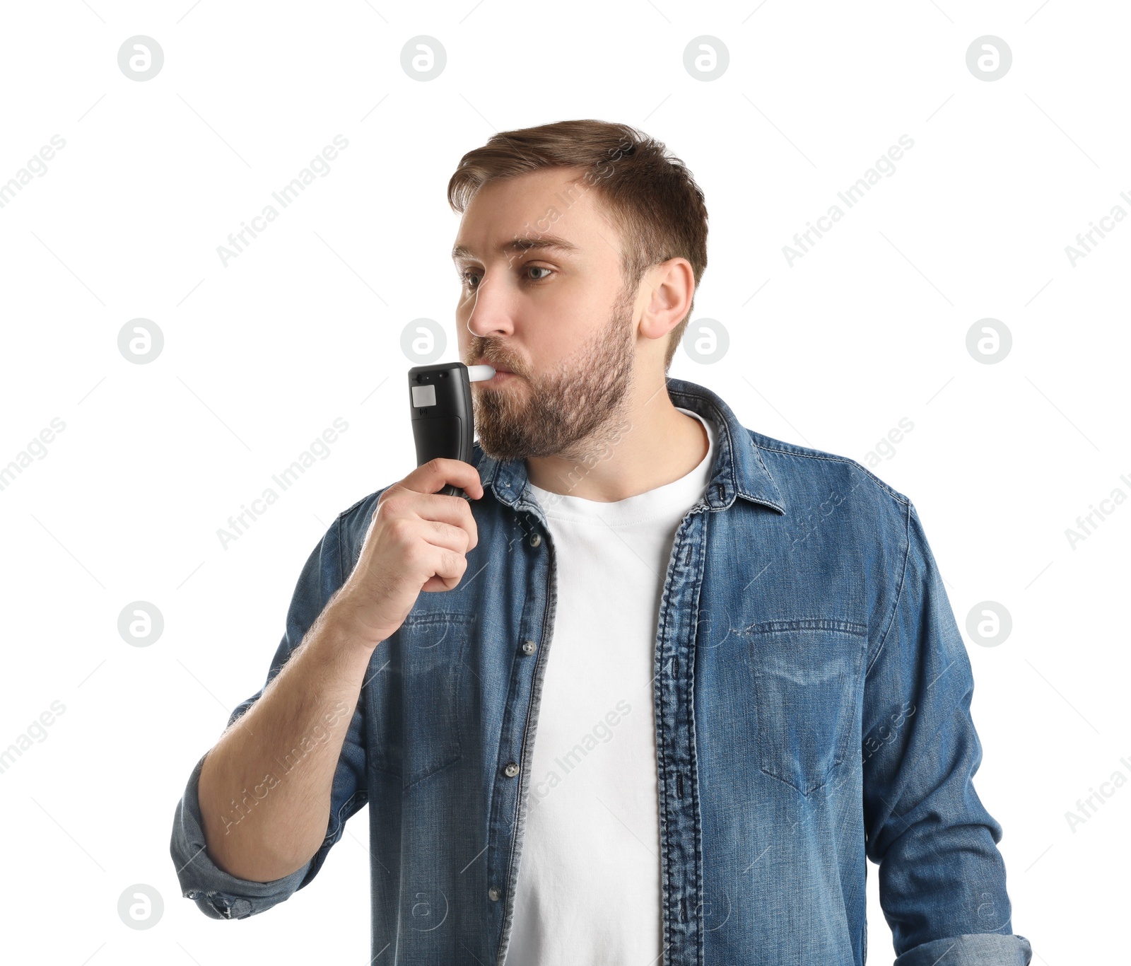 Photo of Man blowing into breathalyzer on white background