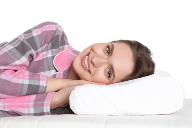 Young woman lying on orthopedic pillow against white background, closeup