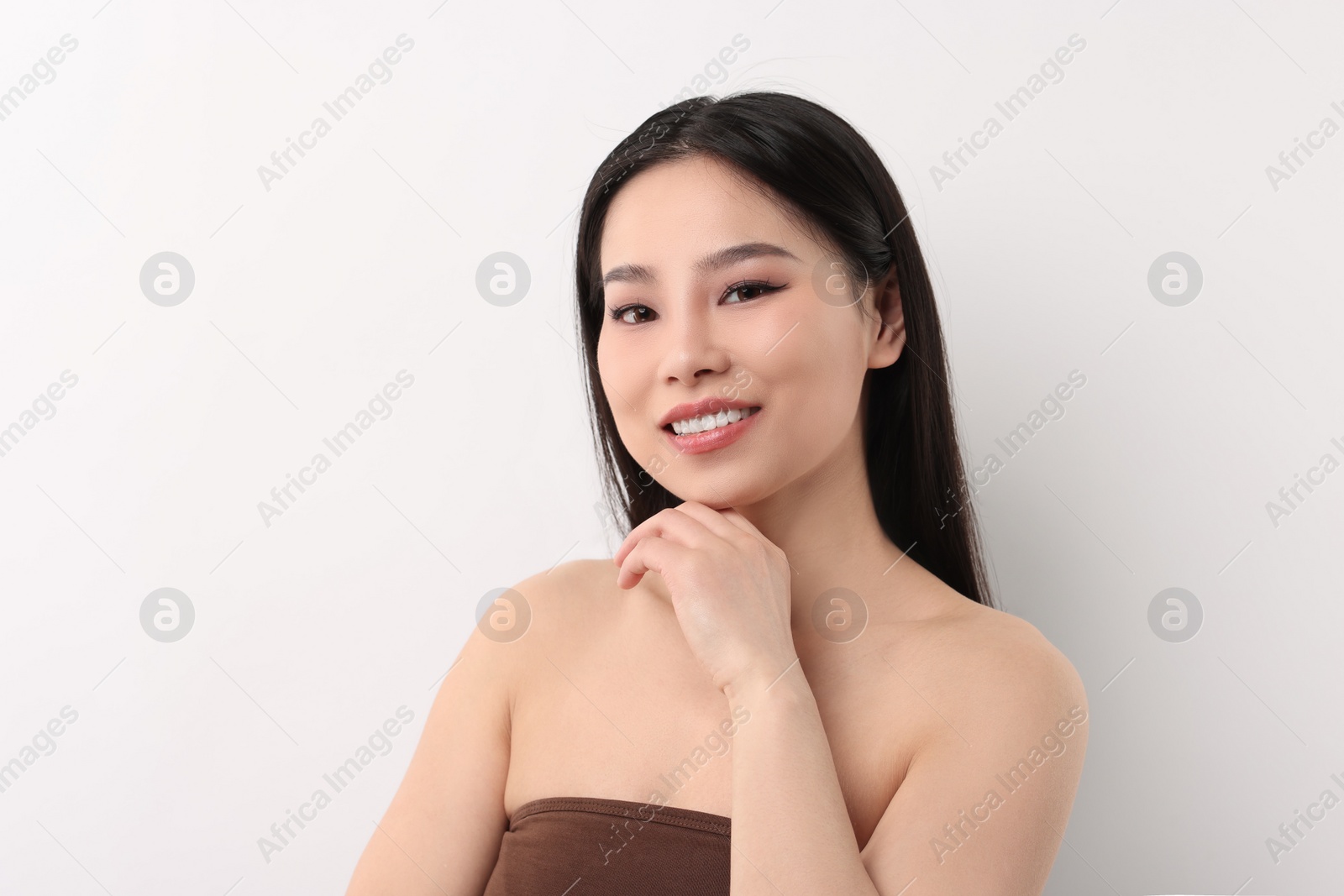 Photo of Portrait of beautiful woman on white background