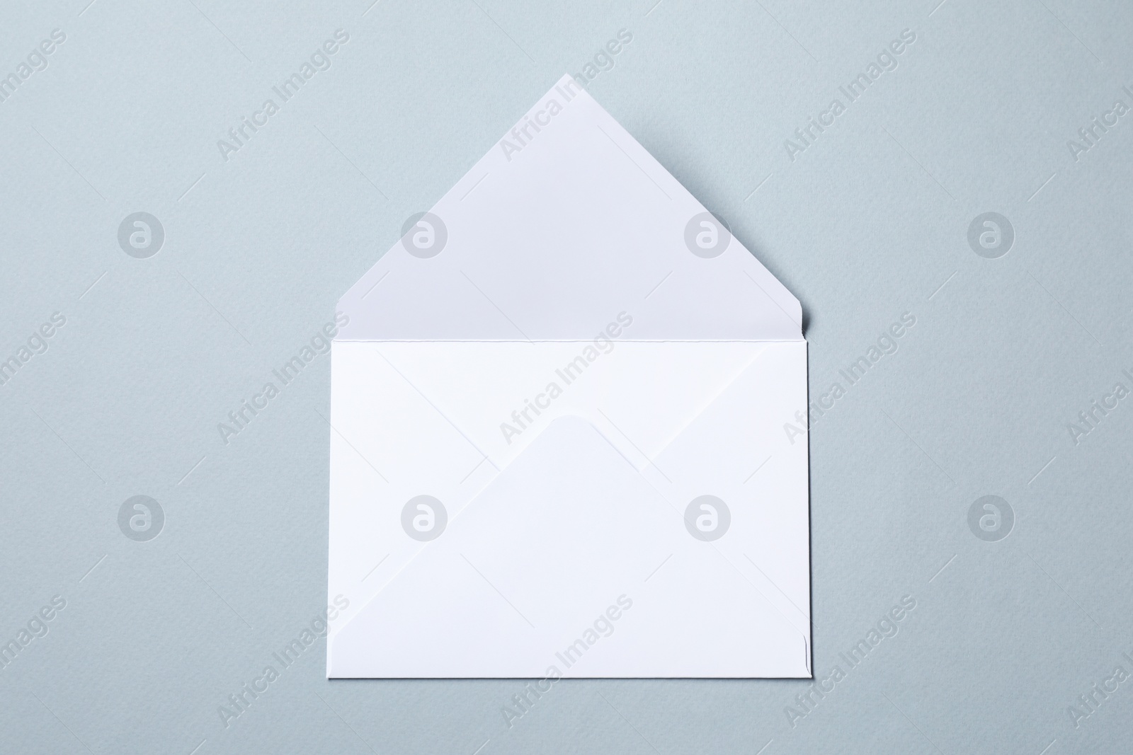 Photo of Letter envelope on grey background, top view