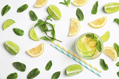 Photo of Flat lay composition with delicious natural lemonade on white background