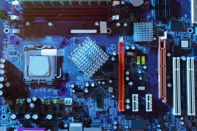 Motherboard as background, top view. Computer repair service