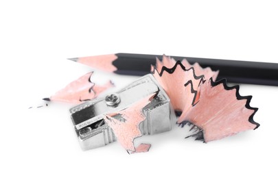 Photo of Metal sharpener with shavings and pencil on white background