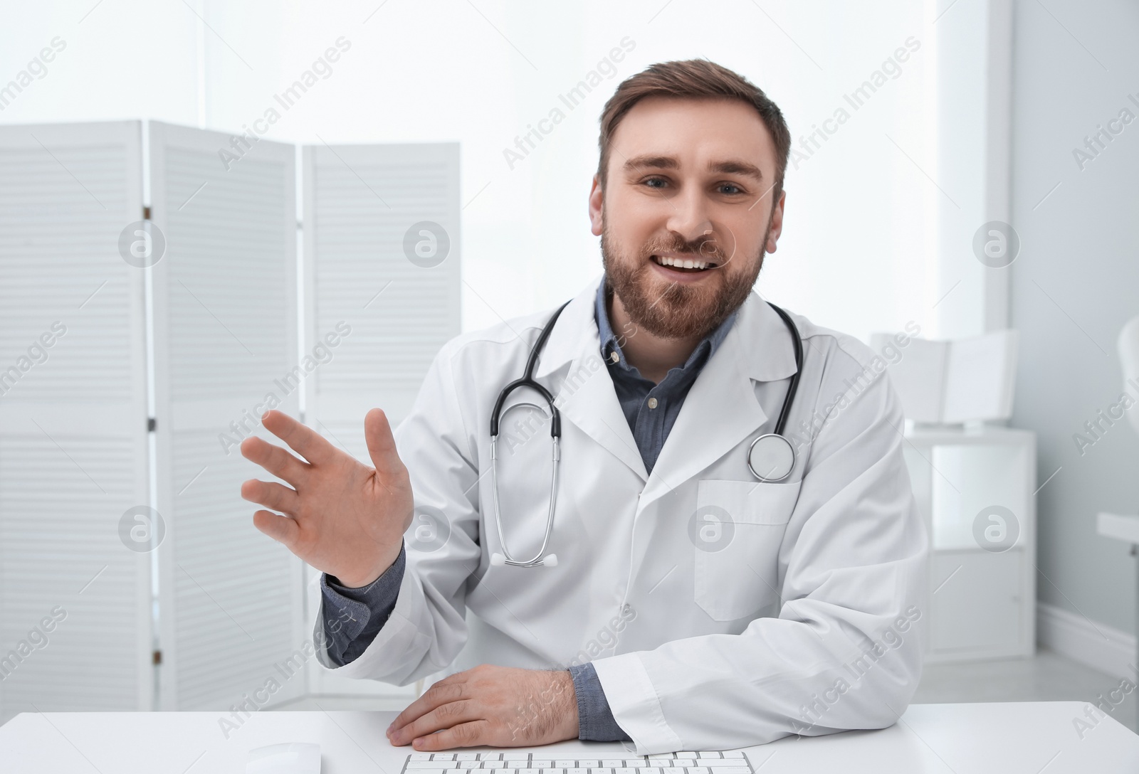 Photo of Pediatrician consulting patient using video chat in clinic, view from webcam