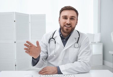 Pediatrician consulting patient using video chat in clinic, view from webcam