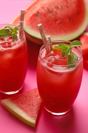 Photo of Tasty watermelon drink with mint on pink background, closeup