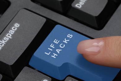 Image of Woman pressing blue button with words Life Hacks on computer keyboard, closeup