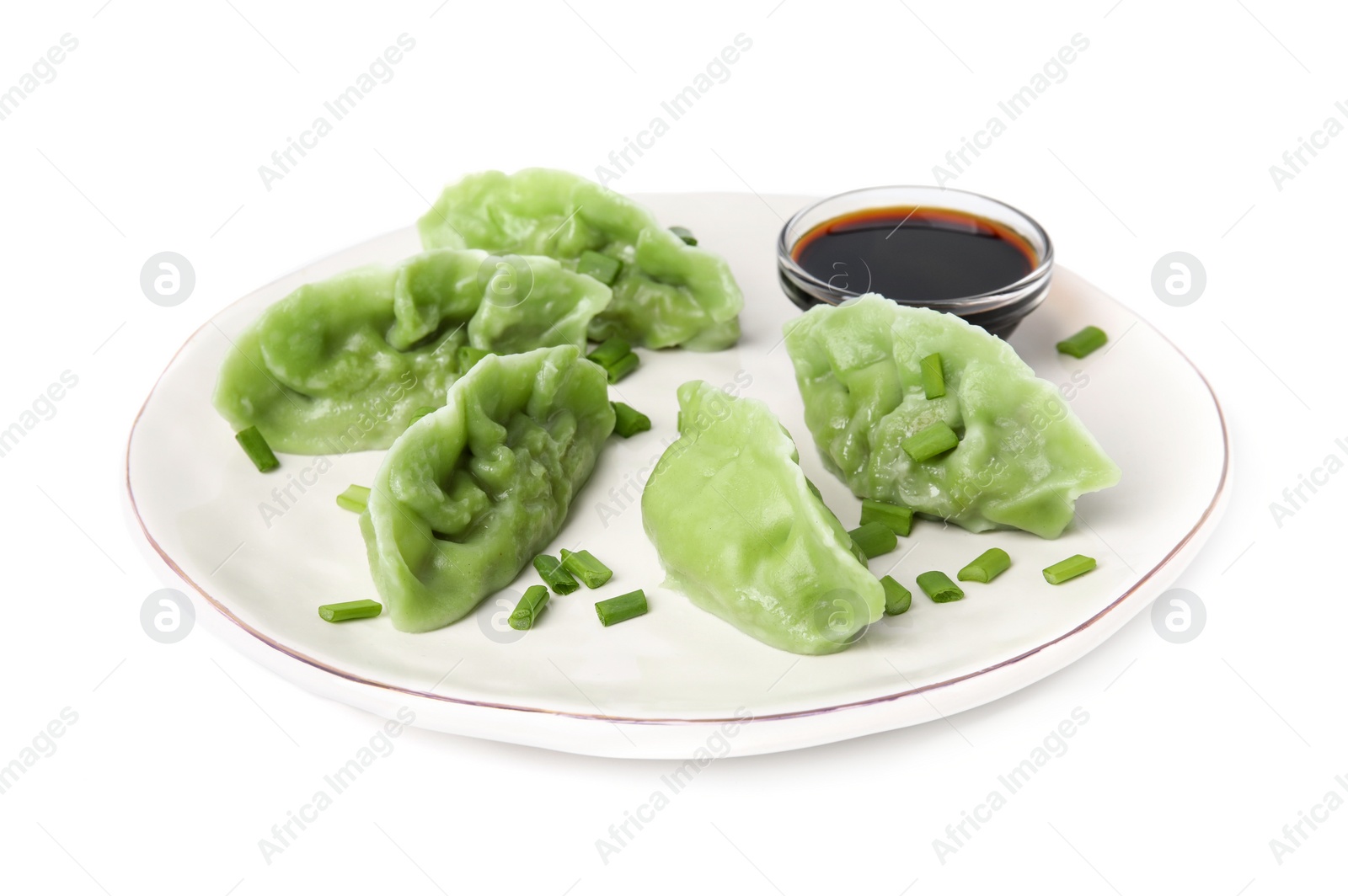 Photo of Delicious green dumplings (gyozas) and soy sauce isolated on white