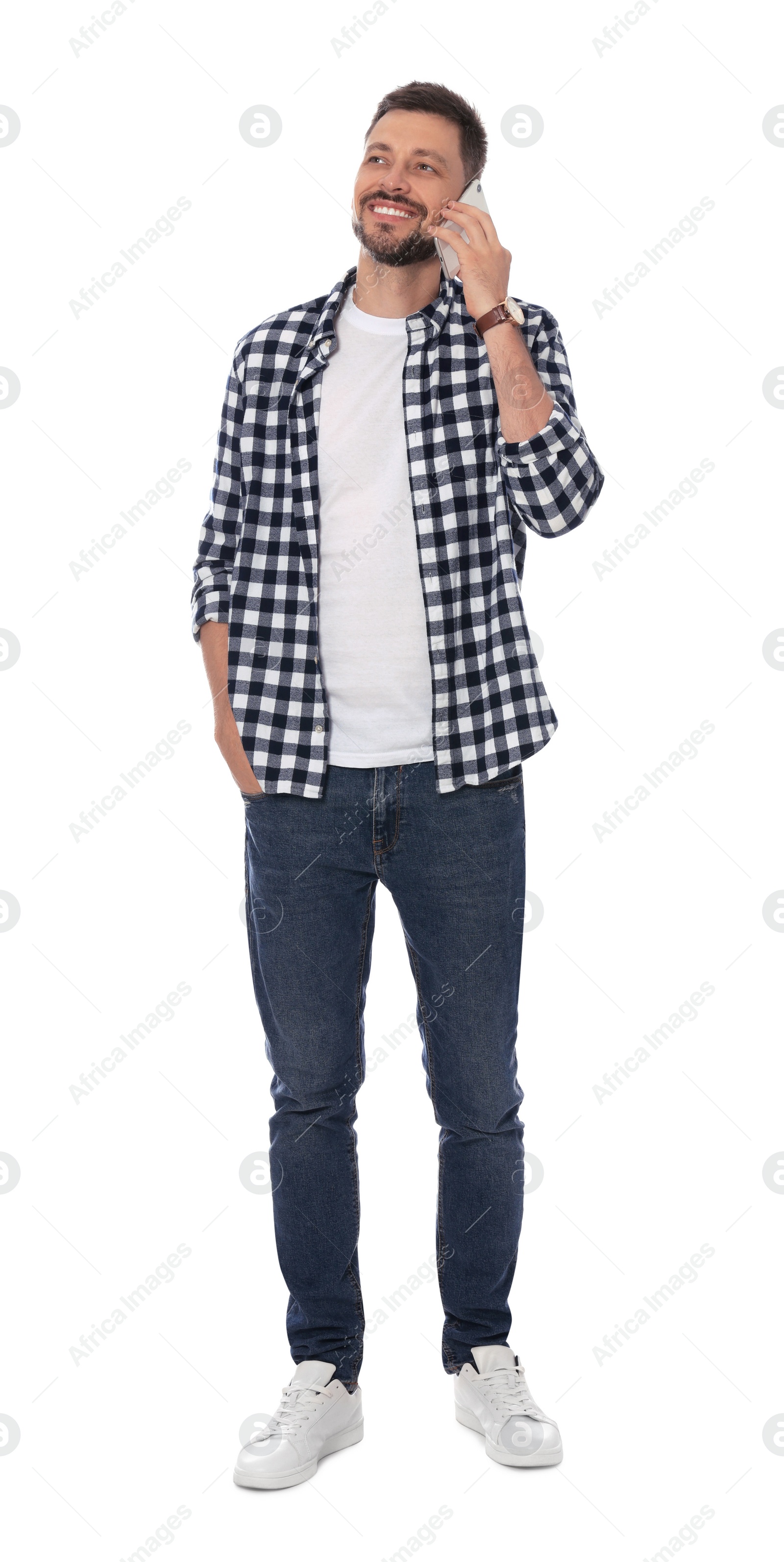 Photo of Handsome man talking on smartphone against white background