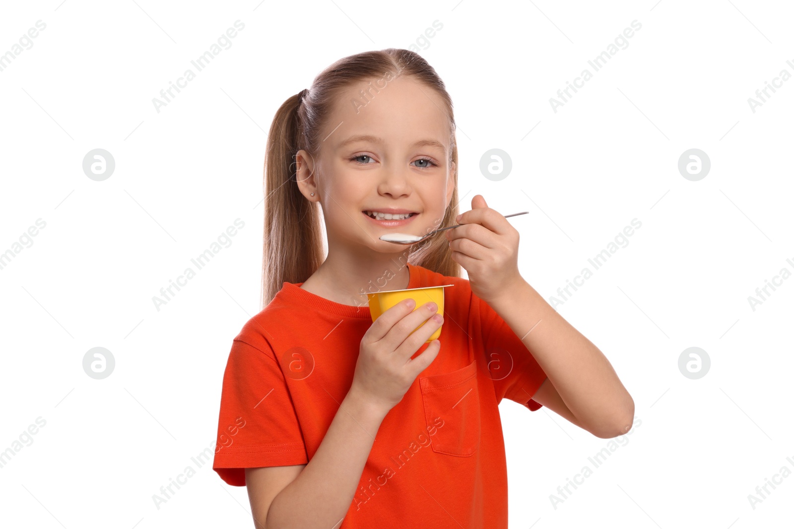 Photo of Cute little girl with tasty yogurt on white background