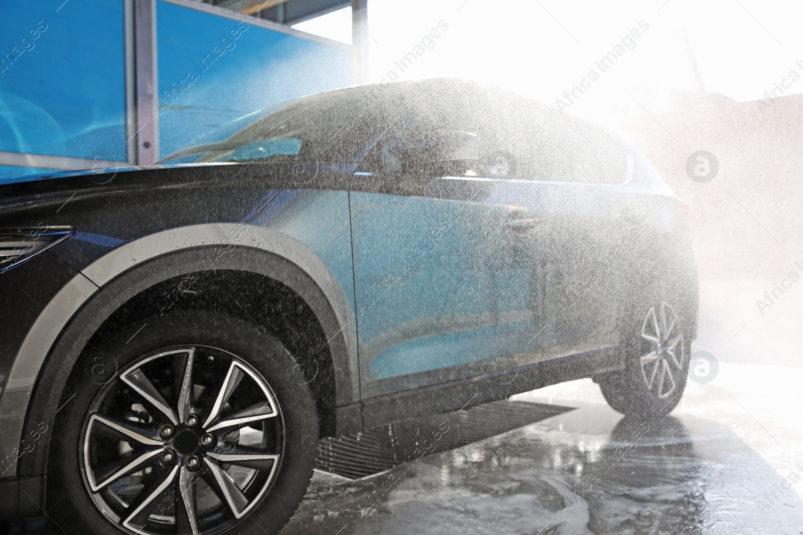 Photo of Clean wet automobile at professional car wash