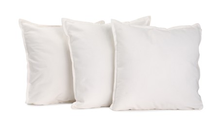 Many new soft pillows isolated on white