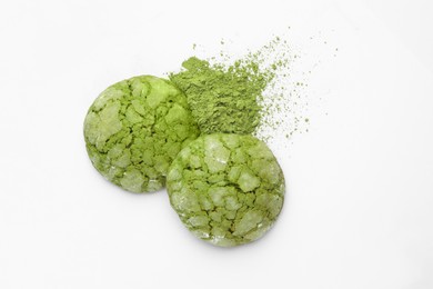 Photo of Tasty matcha cookies and powder on white background, top view