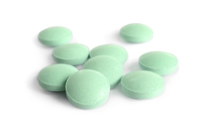 Photo of Many light green pills isolated on white