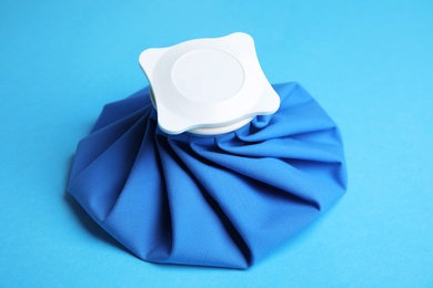 Photo of Ice pack on blue background. Cold compress