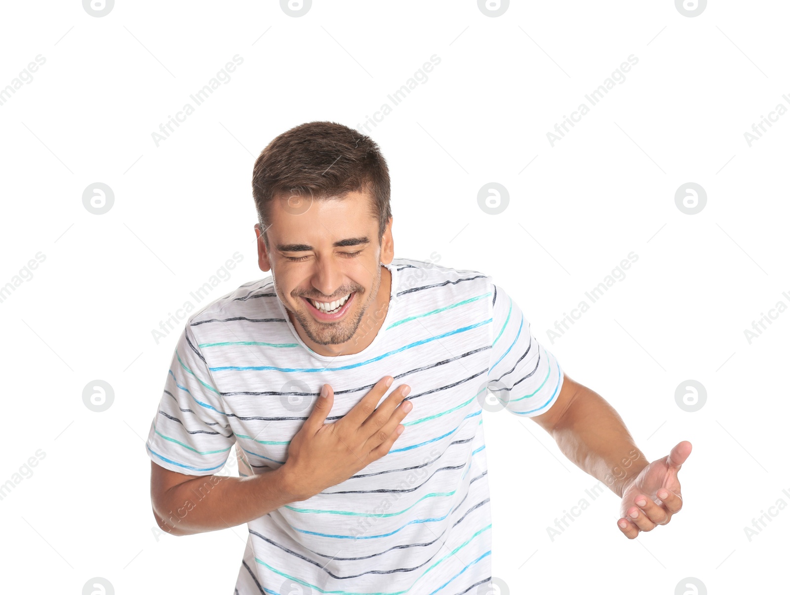 Photo of Portrait of handsome young man laughing on white background