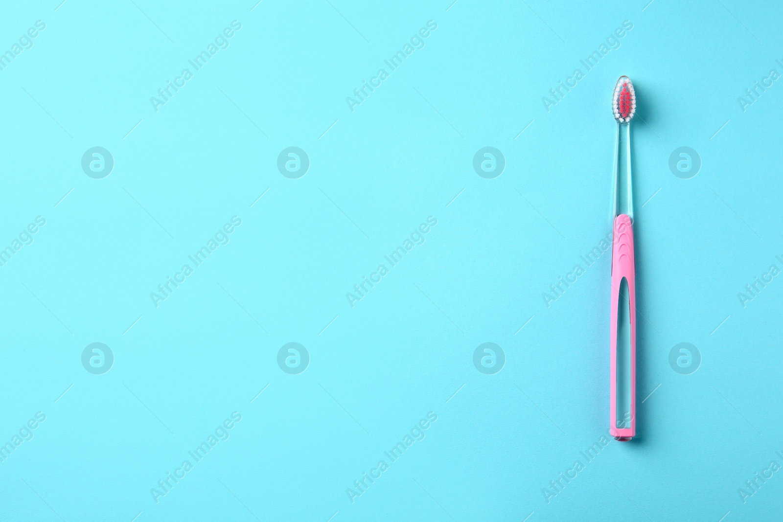 Photo of Manual toothbrush on color background. Dental care