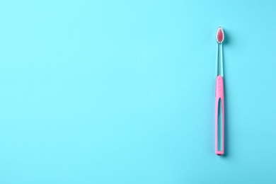 Manual toothbrush on color background. Dental care