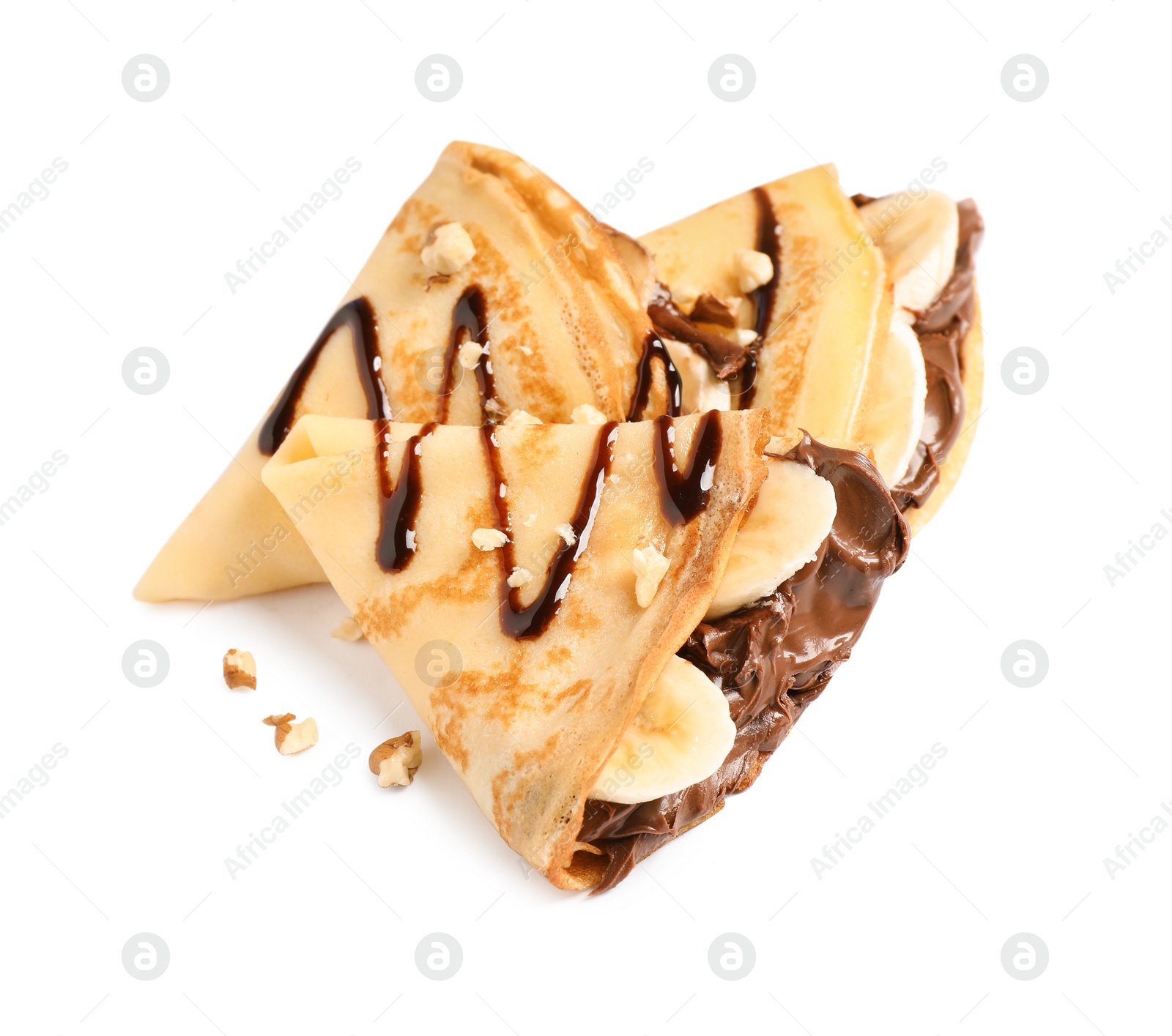 Photo of Delicious thin pancakes with chocolate spread, banana and nuts on white background