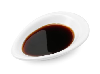 Photo of Tasty soy sauce in gravy boat isolated on white, above view