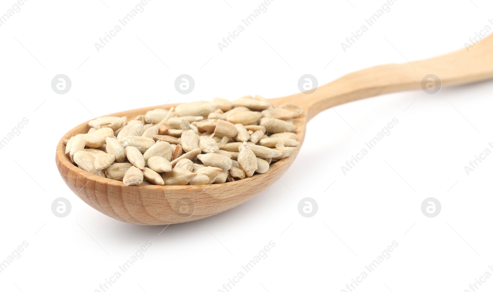 Photo of Peeled sunflower seeds in spoon on white background, closeup