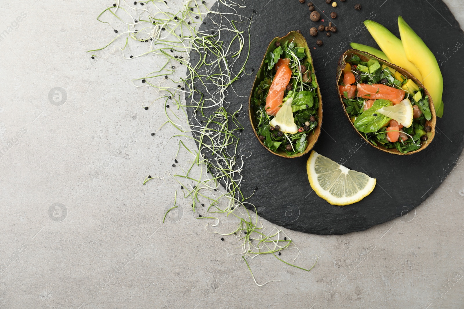 Photo of Delicious salmon with spinach served on grey table, flat lay. Space for text