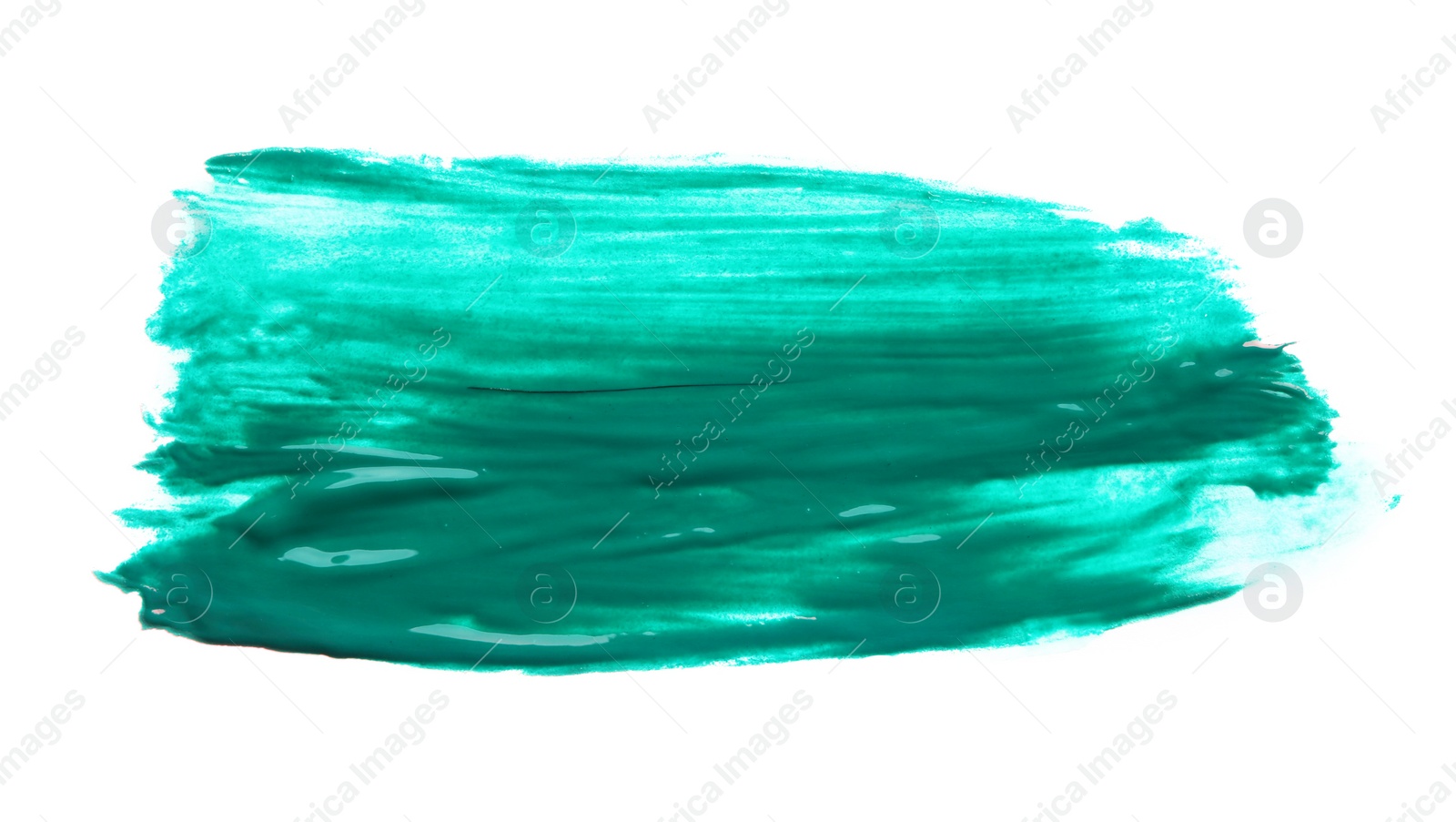 Photo of Abstract brushstroke of green paint isolated on white