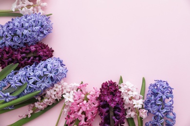 Frame made of spring hyacinth flowers on color background. Space for text